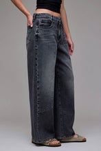 Load image into Gallery viewer, Person wearing wide-leg jeans on a plain background