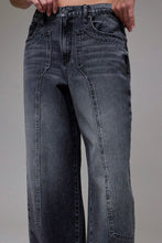 Load image into Gallery viewer, Black jeans worn by a person on a gray background
