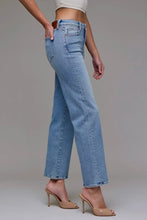 Load image into Gallery viewer, Person wearing light blue jeans on a plain background