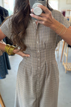 Load image into Gallery viewer, Person wearing a checkered dress taking a mirror selfie in a clothing store.
