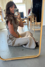 Load image into Gallery viewer, Person taking a mirror selfie wearing a checkered dress in an indoor setting.