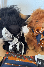Load image into Gallery viewer, Close-up of a plush horse with decorative elements on a white background