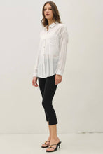 Load image into Gallery viewer, Woman wearing a white blouse and black pants against a white background