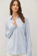 Load image into Gallery viewer, Woman wearing a light blue striped shirt against a plain background