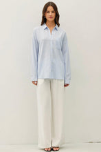 Load image into Gallery viewer, Woman wearing a light blue striped shirt and white pants on a plain background