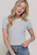 Load image into Gallery viewer, Woman wearing a striped shirt and jeans against a plain background