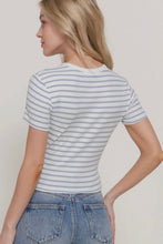 Load image into Gallery viewer, Woman wearing a striped t-shirt and jeans against a plain background