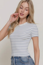 Load image into Gallery viewer, Woman wearing a striped shirt and jeans against a plain background
