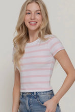 Load image into Gallery viewer, Woman wearing a pink and white striped shirt with blue jeans against a plain background