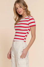 Load image into Gallery viewer, Woman wearing a red and white striped shirt with beige pants on a beige background