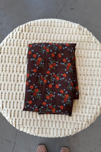 Floral-patterned fabric on a woven surface