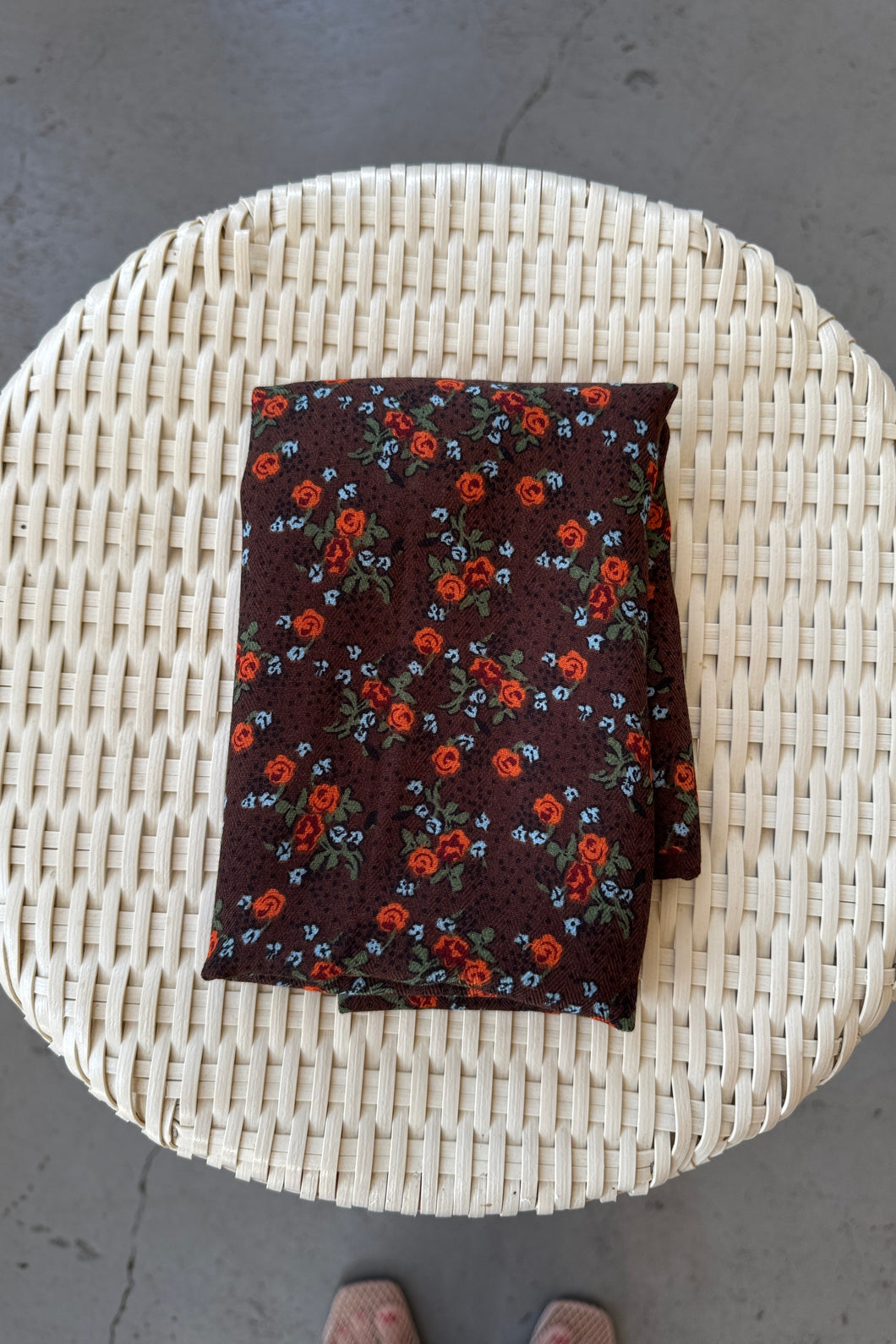 Floral-patterned fabric on a woven surface