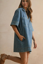 Load image into Gallery viewer, Woman wearing a denim dress on a beige background