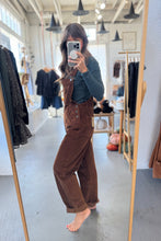 Load image into Gallery viewer, Person taking a mirror selfie wearing brown corduroy pants and a dark top in a clothing store.