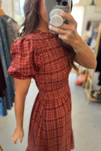 Load image into Gallery viewer, Person wearing a red plaid dress in a store setting