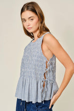 Load image into Gallery viewer, Woman wearing a sleeveless checkered top with a plain background