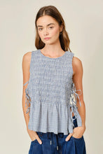 Load image into Gallery viewer, Woman wearing a sleeveless checkered top with a plain background