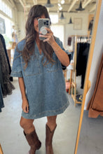 Load image into Gallery viewer, Person wearing a denim dress and brown boots in a clothing store.