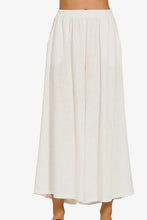 Load image into Gallery viewer, White skirt worn by a person on a white background