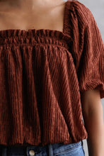 Load image into Gallery viewer, Brown textured off-shoulder top worn by a person against a neutral background