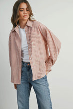 Load image into Gallery viewer, Woman wearing a striped shirt over a white top and jeans on a plain background