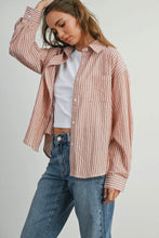 Load image into Gallery viewer, Woman wearing a striped shirt and jeans on a plain background