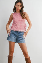 Load image into Gallery viewer, Woman wearing a red checkered top and denim shorts on a plain background