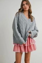 Load image into Gallery viewer, Woman wearing a gray cable knit sweater and red checkered skirt on a plain background