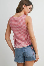 Load image into Gallery viewer, Woman wearing a red plaid sleeveless top and denim shorts on a white background