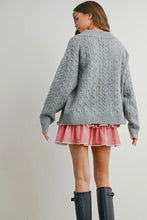 Load image into Gallery viewer, Person wearing a gray cable knit sweater and red plaid skirt with black boots on a plain background