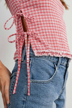 Load image into Gallery viewer, Red and white checkered top with tied sleeves worn over blue jeans on a plain background