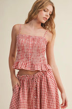 Load image into Gallery viewer, Woman wearing a red and white checkered dress against a beige background