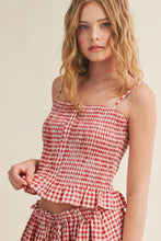 Load image into Gallery viewer, Woman wearing a red and white checkered top and skirt on a beige background