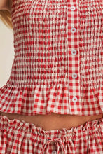 Load image into Gallery viewer, Red and white checkered top with smocked details on a plain background