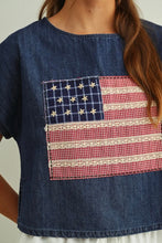 Load image into Gallery viewer, Denim shirt with an American flag patch on a plain background