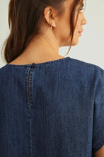 Load image into Gallery viewer, Person wearing a blue denim shirt with a plain background