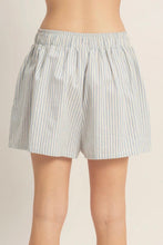 Load image into Gallery viewer, Striped shorts worn by a person on a plain background