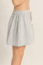 Load image into Gallery viewer, Striped skirt worn by a person on a beige background