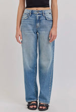 Load image into Gallery viewer, Person wearing light blue jeans on a plain background