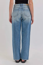 Load image into Gallery viewer, Person wearing light blue jeans on a plain background