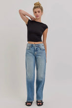 Load image into Gallery viewer, Woman wearing a black crop top and blue jeans on a plain background