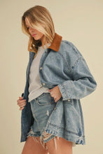 Load image into Gallery viewer, Woman wearing a denim jacket with a brown collar on a beige background