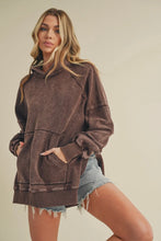 Load image into Gallery viewer, Woman wearing a brown hoodie and denim shorts on a beige background