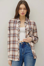 Load image into Gallery viewer, Woman wearing a plaid shirt over a white top and blue jeans against a plain background
