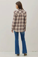 Load image into Gallery viewer, Woman wearing a plaid shirt and blue jeans against a plain background
