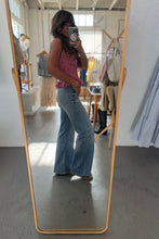 Load image into Gallery viewer, Person taking a mirror selfie wearing a red top and blue jeans in a room with a full-length mirror.