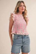 Load image into Gallery viewer, Woman wearing a pink checkered top and denim shorts on a beige background