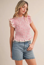 Load image into Gallery viewer, Woman wearing a pink checkered top and denim shorts on a beige background