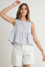 Load image into Gallery viewer, Woman wearing a checkered sleeveless top and white shorts on a plain background
