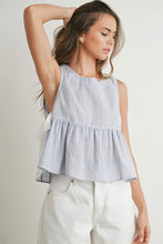 Load image into Gallery viewer, Woman wearing a checkered sleeveless top with ruffled layers on a plain background